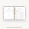 An open spiral-bound booklet or planner showing printed introduction and instructions pages, centered on a light gray background with the text 'INTRODUCTION & INSTRUCTIONS' below.