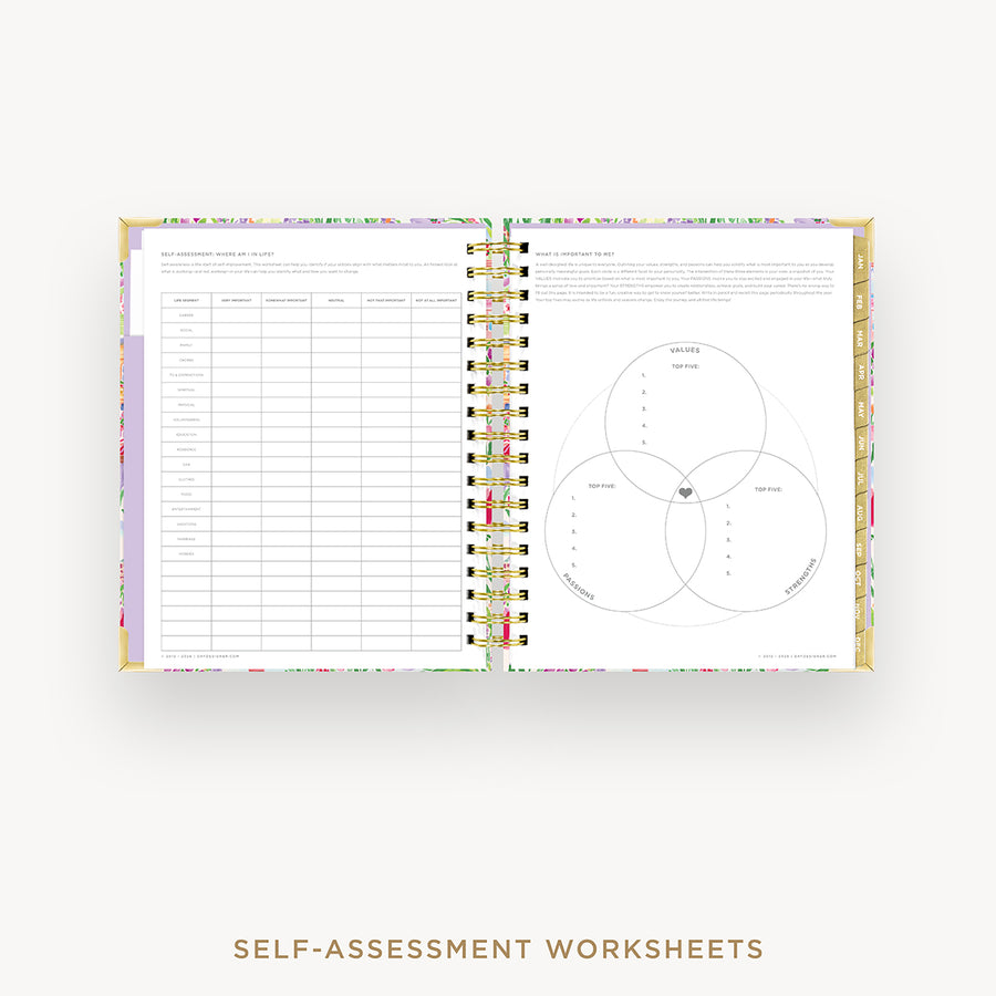 An open spiral-bound planner or notebook showing self-assessment worksheet pages, with a floral-patterned cover and gold-toned spiral rings, on a light gray background. Text below reads 'SELF-ASSESSMENT WORKSHEETS'.