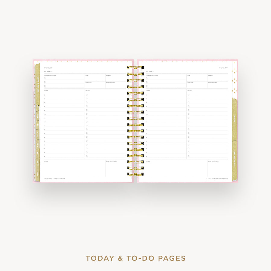 An open spiral-bound planner showing today and to-do pages, with a white page layout, gold accents, and a light pink outer cover visible on a clean white background. Text below reads 'TODAY & TO-DO PAGES'.