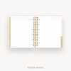 An open spiral-bound planner or notebook showing lined notes pages with gold and pink accents, centered on a light gray background with the text 'NOTES PAGES' below.