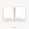 An open spiral-bound planner showing the expenses page with lined columns, gold ring binding, and a light pink cover, centered on a light gray background with the word EXPENSES below.