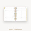 An open spiral-bound weekly planner page with white lined sections, gold decorative accents, and a light pink border, shown on a clean white background with the text 'WEEKLY PLANNING PAGE' below.