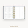 An open spiral-bound planner or agenda with white pages, gold wire binding, and a gold page marker strip on the right side, shown on a light gray background with the text 'IMPORTANT DATES' below.
