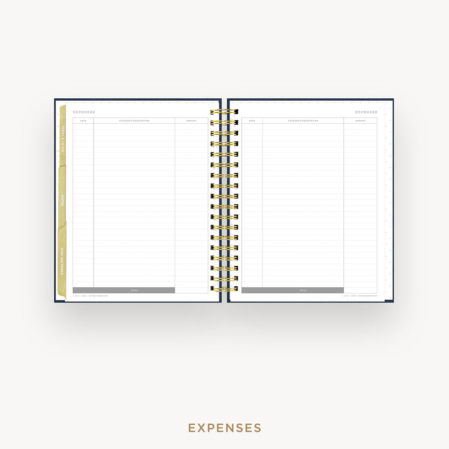An open spiral-bound planner showing an expenses page with lined columns, gold rings, and a gold vertical tab on the left, centered on a light gray background with the word EXPENSES below.