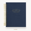 A navy blue spiral-bound planner cover with gold wire binding and gold foil text reading 'DAY DESIGNER.' on a clean white background.