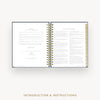 An open spiral-bound booklet or manual with two printed pages shown against a light gray background. The pages contain small black text and a gold vertical strip along the right page edge.
