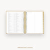 An open spiral-bound planner or agenda with white pages, gold binding, and gold page edges, showing a detailed calendar-style table on the left page and lined notes on the right. The words 'IMPORTANT DATES' appear below on a light gray background.