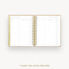 An open spiral-bound thank you note record planner on a light gray background, with gold-toned binding and gold text reading 'THANK YOU NOTE RECORD' below.