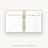 An open spiral-bound monthly calendar planner on a light gray background, showing a January 2027 calendar spread with tabbed pages and gold-toned binding. Text below reads 'TABBED MONTHLY CALENDAR'.