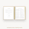 An open spiral-bound booklet showing printed introduction and instructions pages, centered on a light gray background with the text 'INTRODUCTION & INSTRUCTIONS' below.