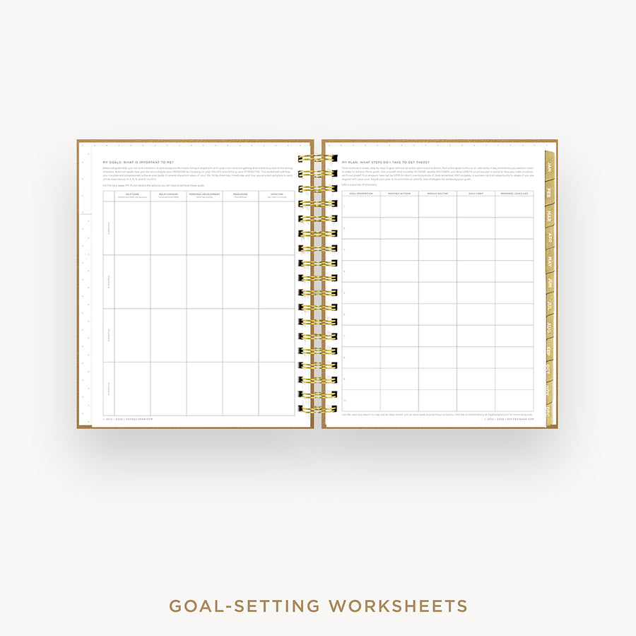An open spiral-bound planner or notebook showing two pages of goal-setting worksheets, with a gold wire binding and gold-toned page edges, centered on a light gray background. Text below reads 'GOAL-SETTING WORKSHEETS'.