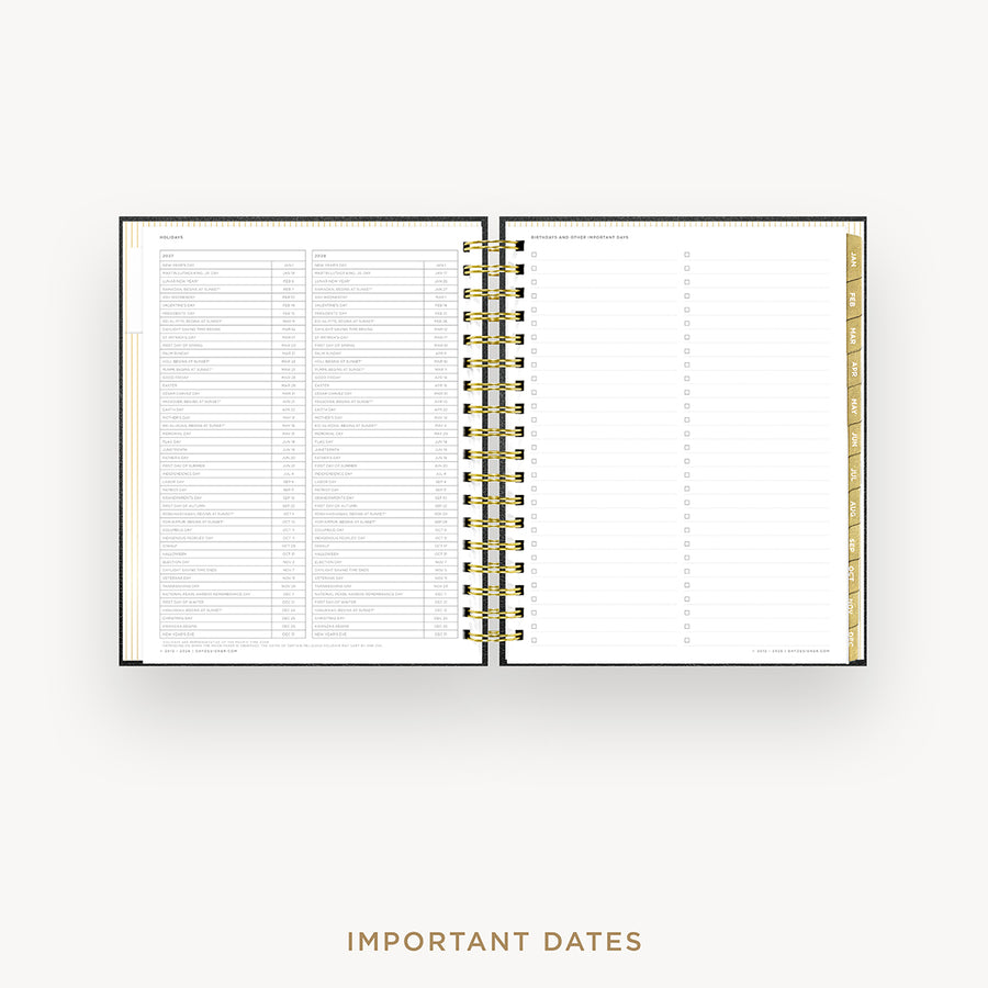 Open notebook showing two pages with text and a gold spiral binding on a white background.