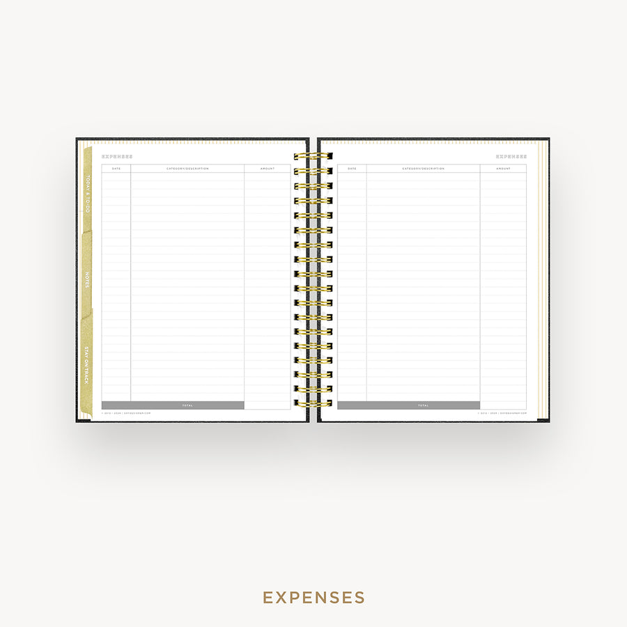 An open spiral-bound planner showing an expenses page with lined columns, gold rings, and a gold vertical tab, centered on a light gray background with the word EXPENSES below.