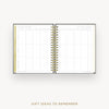 An open spiral-bound planner or notebook showing a gift ideas to remember grid page, photographed on a light gray background with the text 'GIFT IDEAS TO REMEMBER' below.