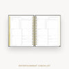 An open spiral-bound planner showing two pages of an Entertainment Checklist layout, photographed on a light gray background with the text 'ENTERTAINMENT CHECKLIST' below.