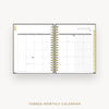 An open tabbed monthly calendar with a gold spiral binding, showing a January 2027 calendar spread on a light gray background with the text 'TABBED MONTHLY CALENDAR' below.
