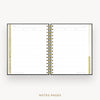 An open spiral-bound planner or notebook showing lined notes pages with gold and black accents, centered on a light gray background with the text 'NOTES PAGES' below.