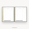 An open spiral-bound planner or notebook showing an expenses page with lined tables and gold-toned ring binding, centered on a light gray background with the word EXPENSES below.