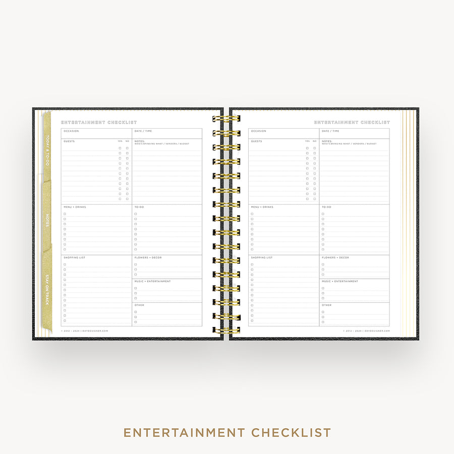 An open spiral-bound planner or checklist book showing two printed pages titled 'ENTERTAINMENT CHECKLIST' with lined sections and tabs, photographed on a light gray background with the title printed below.