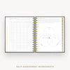An open spiral-bound workbook showing self-assessment worksheet pages, including a table on the left and a Venn diagram on the right, with gold vertical tabs along the right edge. The text 'SELF-ASSESSMENT WORKSHEETS' appears below on a light neutral background.