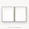 An open spiral-bound planner or notebook showing two pages of goal-setting worksheets with gold-toned binding and a gold vertical index strip on the right. The text 'GOAL-SETTING WORKSHEETS' appears below on a light gray background.