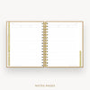 An open spiral-bound planner or notebook with lined pages, gold-toned rings, and gold page edges, shown on a light gray background with the text 'NOTES PAGES' below.