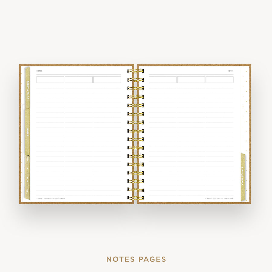 An open spiral-bound planner or notebook with lined pages, gold-toned rings, and gold page edges, shown on a light gray background with the text 'NOTES PAGES' below.