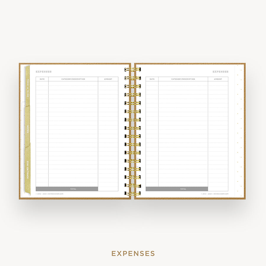 An open spiral-bound planner or notebook showing a clean expenses page layout with lined tables, gold ring binding, and a gold page edge, centered on a light gray background with the word EXPENSES below.