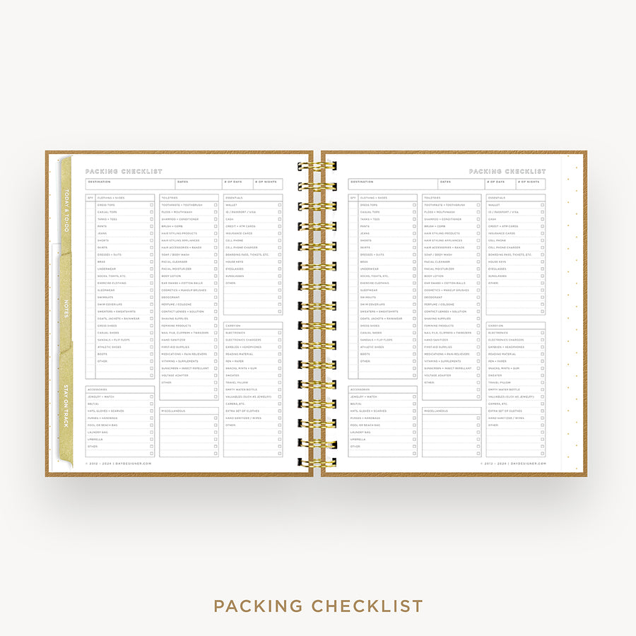 An open spiral-bound planner or notebook showing two printed checklist pages titled 'Packing Checklist,' with gold rings and a light beige cover visible on a clean white background. Text below reads 'Packing Checklist.