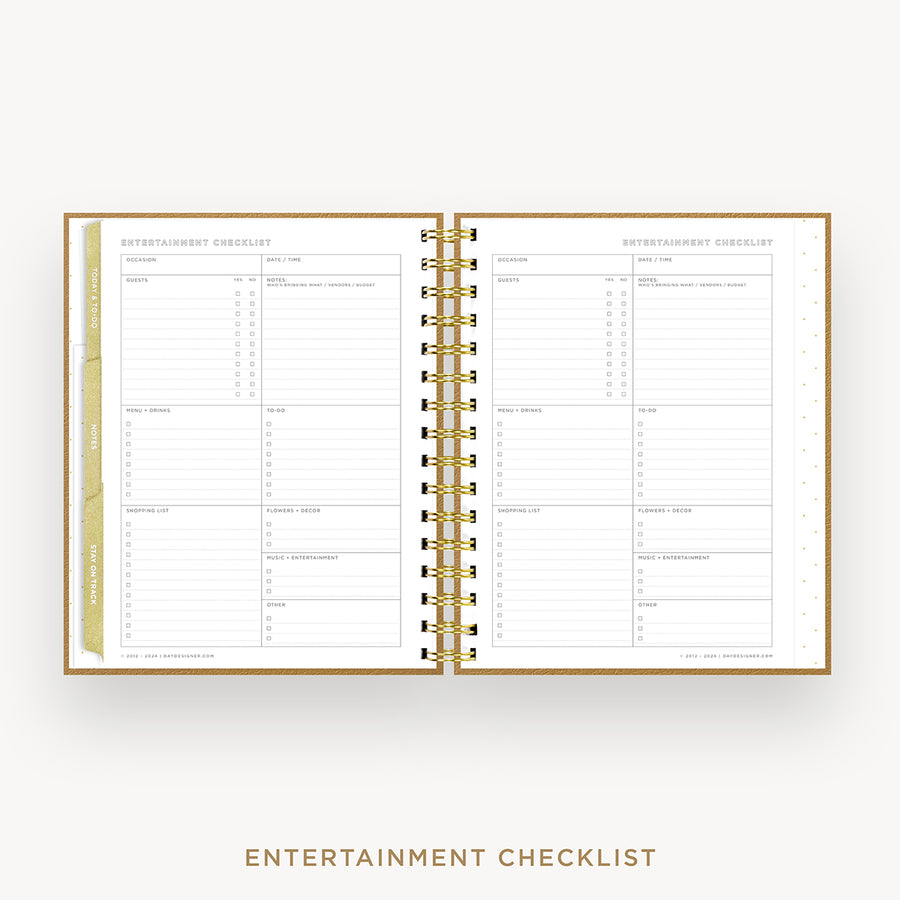 An open spiral-bound planner or checklist book showing two printed pages titled 'ENTERTAINMENT CHECKLIST' on a light gray background. The pages are white with fine gray lines and small gold accents, including a gold vertical tab on the left margin and gold spiral rings.