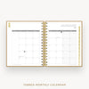 An open spiral-bound monthly calendar planner on a light gray background. The pages are white with gold-toned borders and a gold wire binding, showing January 2027 on the right page and tabbed monthly layouts on the left.
