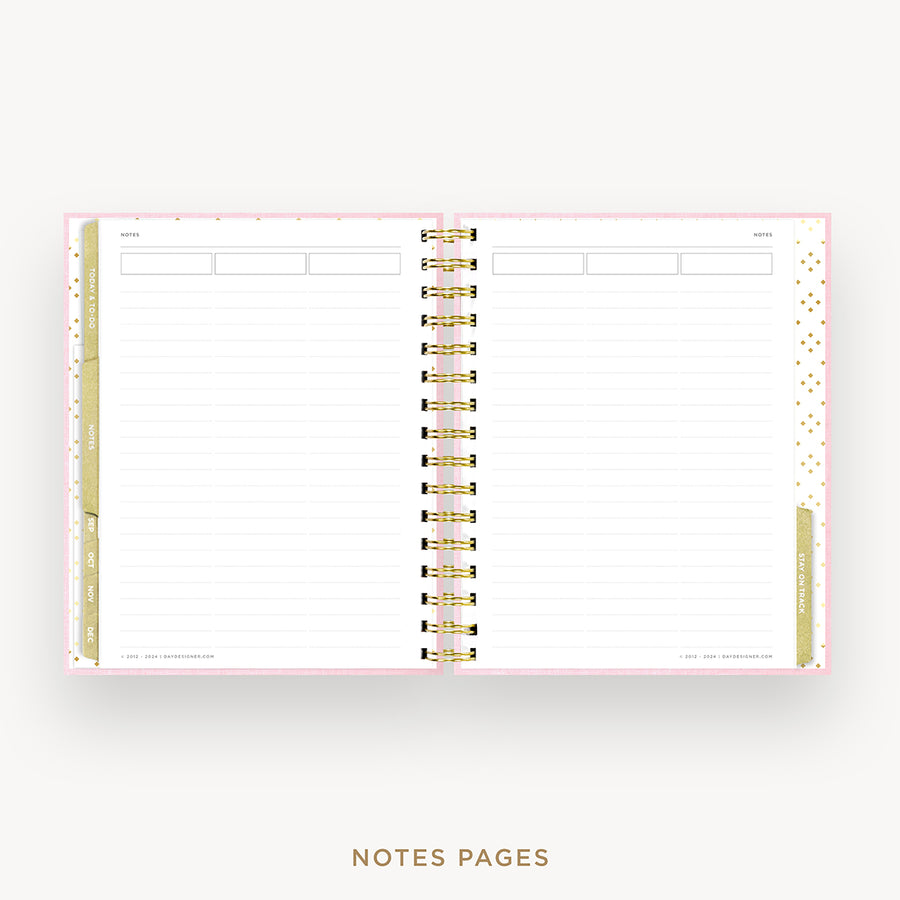 An open spiral-bound planner or notebook showing lined notepad pages, with a pale pink cover, gold polka-dot side tabs, and a central gold spiral binding. The words 'NOTES PAGES' appear below on a light gray background.
