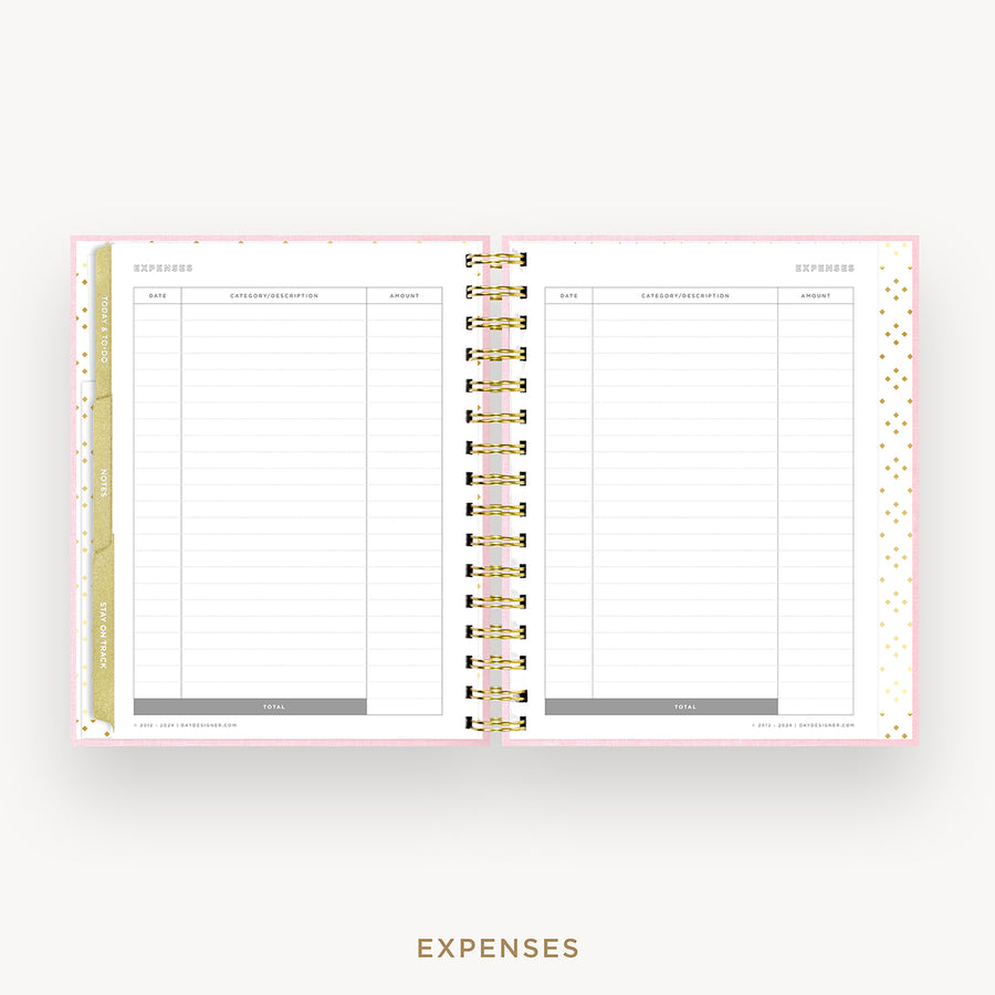 An open spiral-bound planner showing two blank expense pages with gold rings and a light pink border, on a light gray background with the word EXPENSES below.