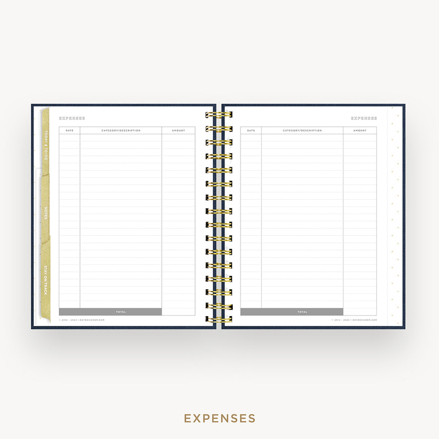 An open spiral-bound planner or notebook showing an expenses page with lined columns, gold ring binding, and a gold vertical tab on the left margin, centered on a light gray background with the word EXPENSES below.