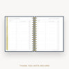 An open spiral-bound thank you note record planner on a light gray background, showing lined pages, checkboxes, and a gold wire coil. The text 'THANK YOU NOTE RECORD' appears below.