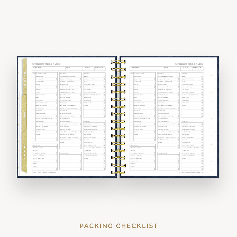 An open spiral-bound planner or notebook showing two printed checklist pages titled 'Packing Checklist,' with a gold-toned ring binder and a narrow gold vertical tab on the left page, set against a light gray background with the words 'Packing Checklist' below.