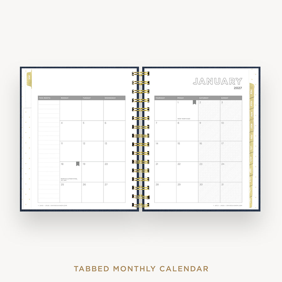 An open tabbed monthly calendar planner shown from above on a light gray background. The pages are white with gray grid lines and headers, bound by a gold spiral in the center.