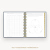An open spiral-bound workbook showing self-assessment worksheet pages, including a table on the left and a Venn diagram on the right, with gold wire binding and a gold vertical page marker. The text 'SELF-ASSESSMENT WORKSHEETS' appears below on a light gray background.