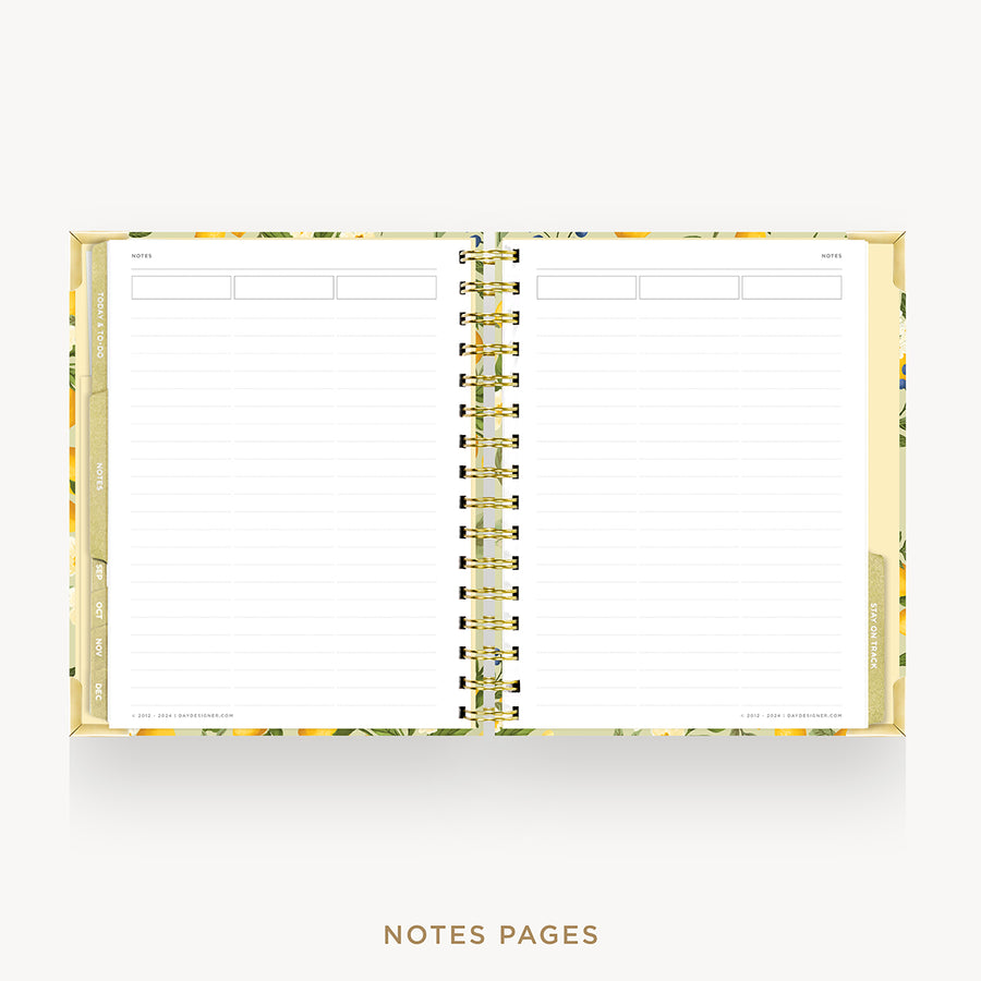 An open spiral-bound planner or notebook with lined white pages, a gold-toned center spiral, and a floral-patterned gold border, shown on a light gray background with the text 'NOTES PAGES' below.