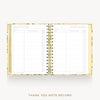 An open spiral-bound thank you note record planner with a gold wire coil and a yellow floral patterned cover, shown on a light gray background with the text 'THANK YOU NOTE RECORD' below.