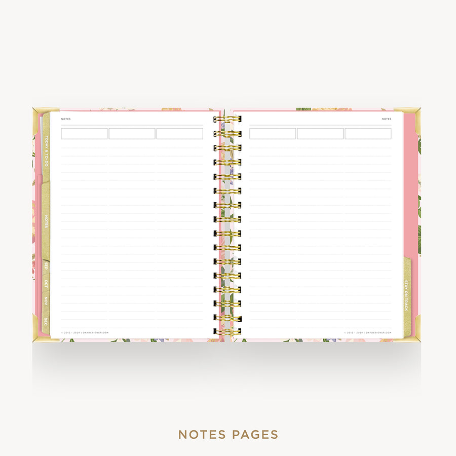 An open spiral-bound planner or notebook showing lined white notes pages, with a pastel pink floral cover and gold-toned spiral binding on a light gray background. The text 'NOTES PAGES' appears below.
