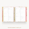 An open spiral-bound planner or notebook showing printed entertainment checklist pages, with a pink floral cover and gold spiral binding on a light gray background. The words 'ENTERTAINMENT CHECKLIST' appear below the product.