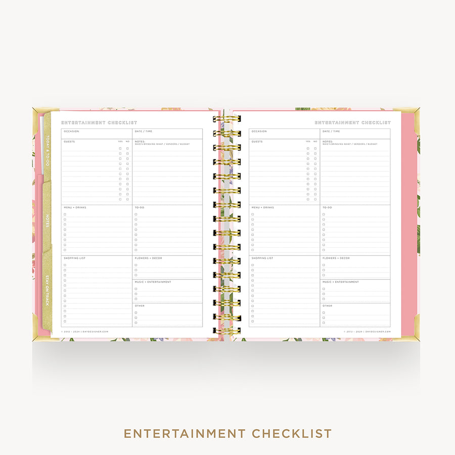 An open spiral-bound planner or notebook showing printed entertainment checklist pages, with a pink floral cover and gold spiral binding on a light gray background. The words 'ENTERTAINMENT CHECKLIST' appear below the product.