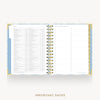 An open spiral-bound planner or agenda showing a monthly calendar layout and lined daily pages, with a light blue and white patterned cover and gold-toned rings, on a light gray background. The words 'IMPORTANT DATES' appear below.