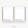 An open spiral-bound planner showing the expenses page with lined columns, a gold wire binding, and a light blue patterned cover, centered on a light gray background with the word EXPENSES below.