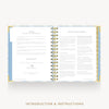 An open spiral-bound booklet or planner showing printed introduction and instructions pages, centered on a light gray background with the text 'INTRODUCTION & INSTRUCTIONS' below.