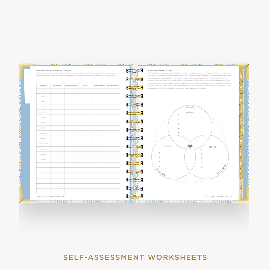 An open spiral-bound workbook showing self-assessment worksheet pages, including a table on the left and a Venn diagram on the right, with decorative blue and gold borders. The text 'SELF-ASSESSMENT WORKSHEETS' appears below on a light gray background.