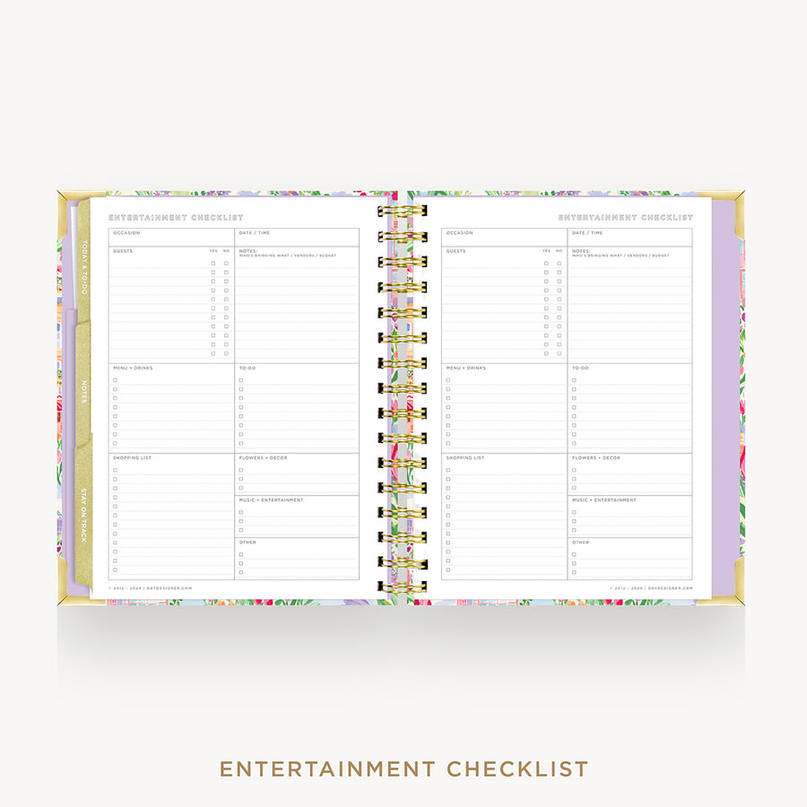 An open spiral-bound planner or notebook showing entertainment checklist pages, with a pastel floral border and gold-toned binding, centered on a light gray background. The text 'ENTERTAINMENT CHECKLIST' appears below.