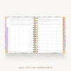 An open spiral-bound planner or notebook showing goal-setting worksheet pages on a light gray background, with the text 'GOAL-SETTING WORKSHEETS' below.