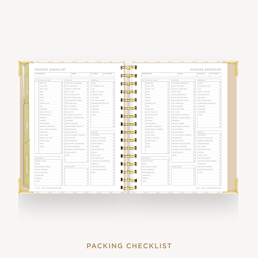 An open spiral-bound checklist planner showing detailed packing and travel checklists on the pages, with gold corner accents and a gold spiral binding, set against a light gray background with the text 'PACKING CHECKLIST' below.